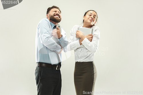 Image of Winning success woman and man happy ecstatic celebrating being a winner.