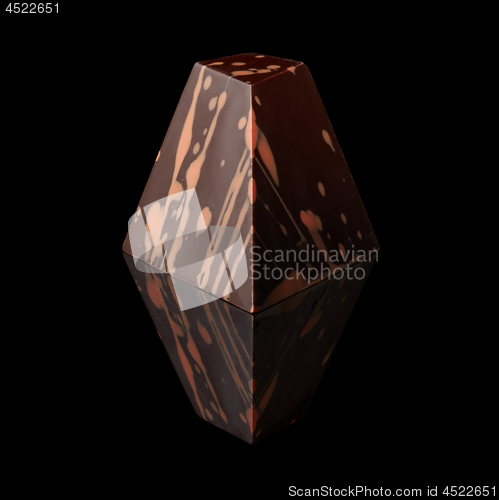 Image of chocolate candy on black background