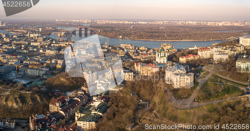 Image of A bird\'s eye view, aerial view shooting from drone of the Podol district, oldest historical center of Kiev, Ukraine, the Dnieper River and the left bank of Dnieper