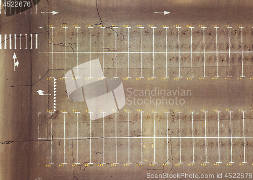 Image of Aerial view from the drone of an empty parking lot with pointing markings. Top view