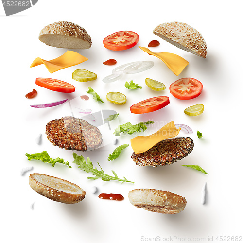 Image of burger with flying ingredients