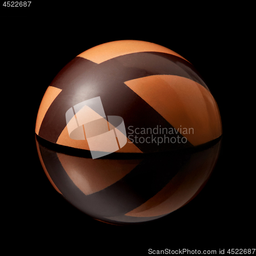 Image of chocolate candy on black background