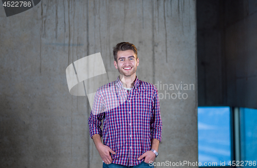 Image of portrait of young male architect on construction site