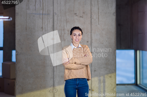 Image of portrait of young female architect on construction site