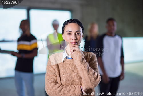 Image of young businesswoman on construction site