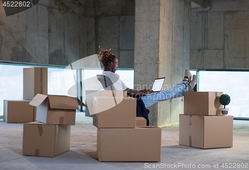 Image of young black male architect on construction site