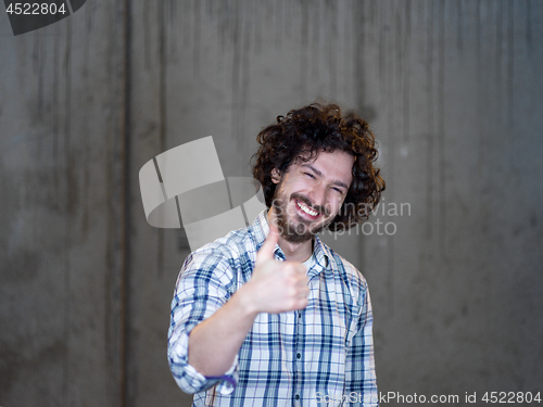 Image of portrait of young male architect on construction site