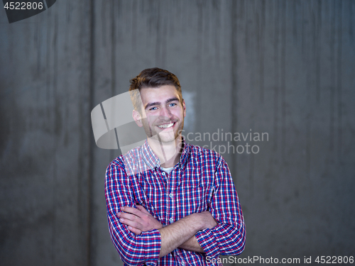 Image of portrait of young male architect on construction site