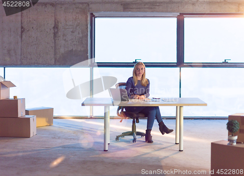 Image of young female architect on construction site