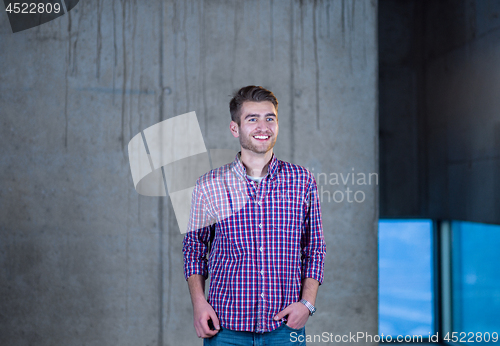 Image of portrait of young male architect on construction site