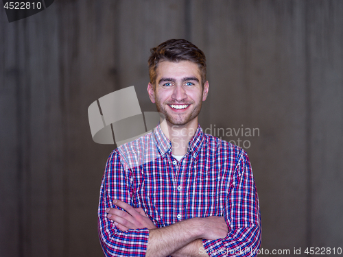 Image of portrait of young male architect on construction site