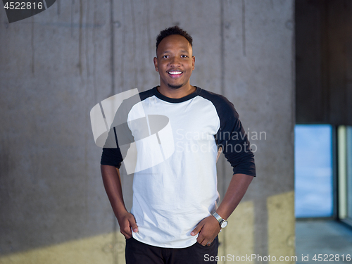 Image of portrait of young black male architect on construction site