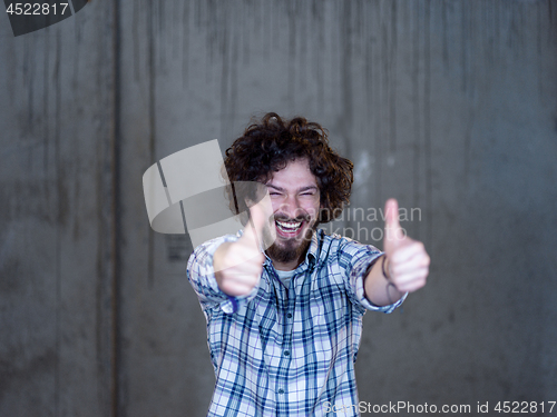 Image of portrait of young male architect on construction site