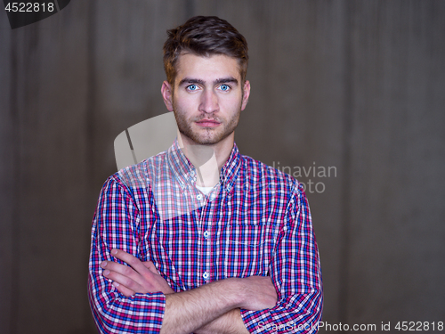 Image of portrait of young male architect on construction site