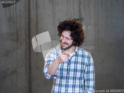 Image of portrait of young male architect on construction site