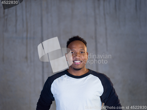 Image of portrait of young black male architect on construction site