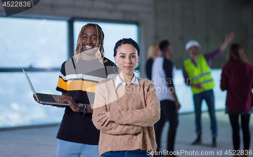 Image of multiethnic business people in group, architect and engineer on 