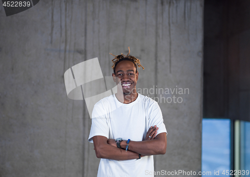Image of portrait of young black male architect on construction site