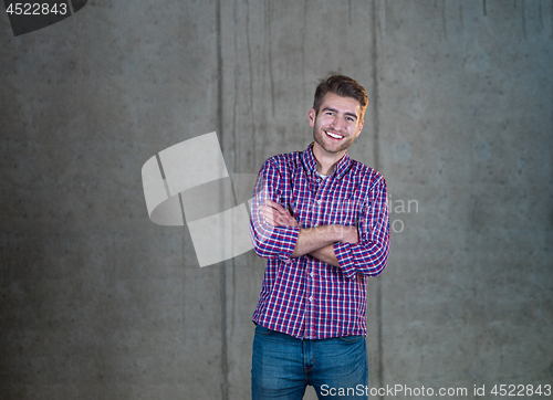 Image of portrait of young male architect on construction site