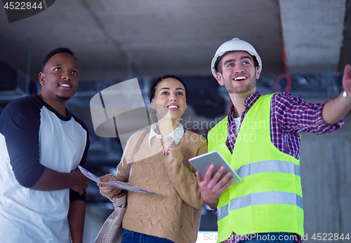 Image of multiethnic business people,architect and engineer on constructi