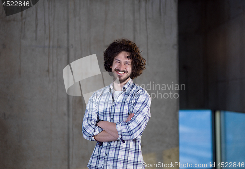 Image of portrait of young male architect on construction site