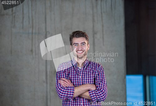 Image of portrait of young male architect on construction site