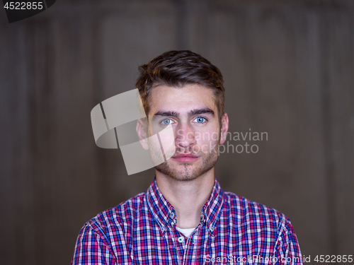 Image of portrait of young male architect on construction site