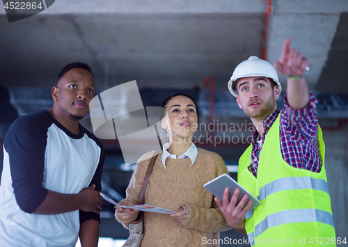 Image of multiethnic business people,architect and engineer on constructi