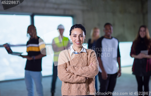 Image of young businesswoman on construction site