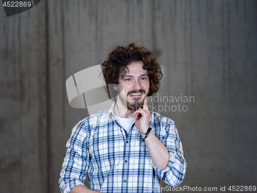 Image of portrait of young male architect on construction site