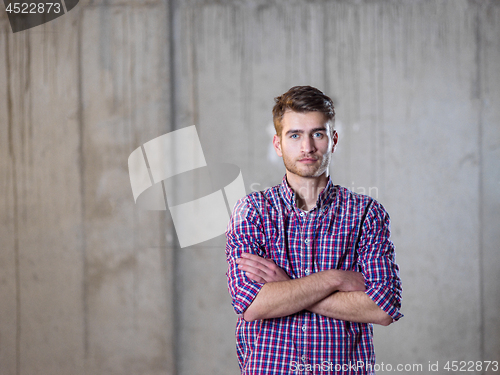 Image of portrait of young male architect on construction site