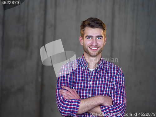 Image of portrait of young male architect on construction site