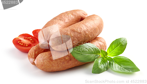 Image of smoked sausages on white background