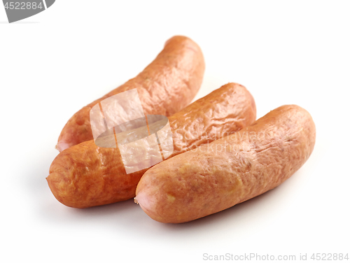 Image of smoked sausages on white background