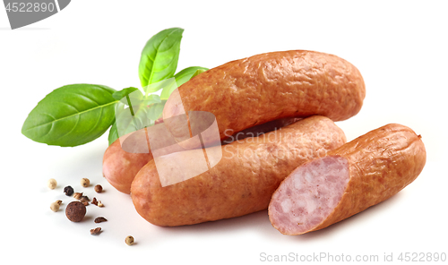 Image of smoked sausages on white background