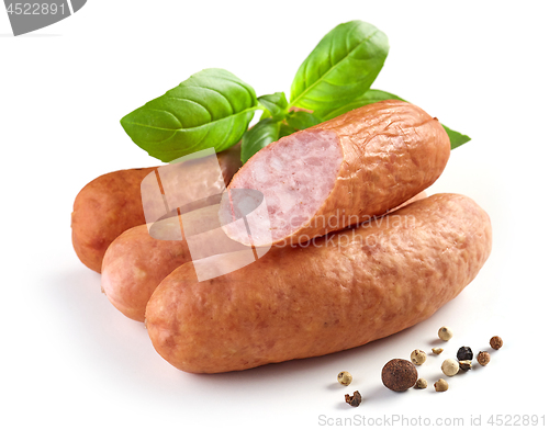 Image of smoked sausages on white background