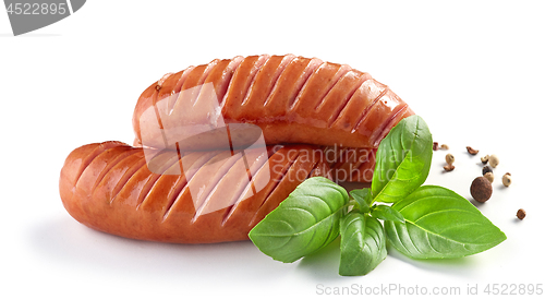 Image of grilled sausages on white background