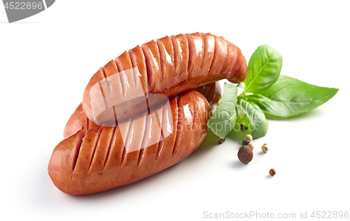 Image of grilled sausages on white background