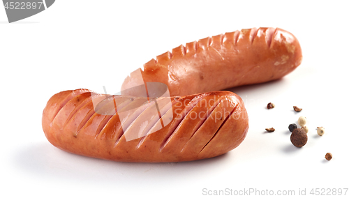 Image of grilled sausages on white background