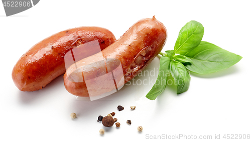 Image of grilled sausages on white background