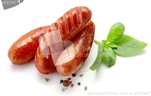 Image of grilled sausages on white background