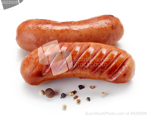 Image of grilled sausages on white background