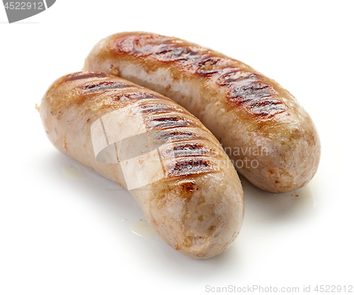 Image of grilled sausages on white background