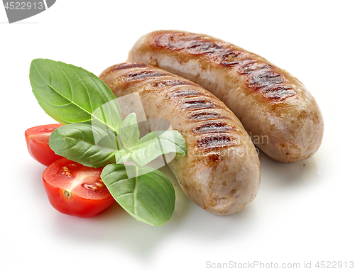 Image of grilled sausages on white background