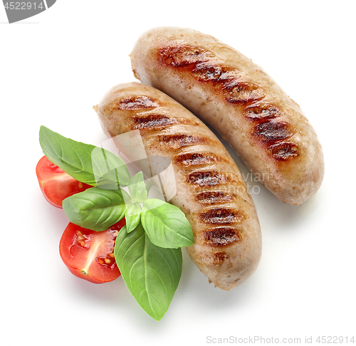 Image of grilled sausages on white background