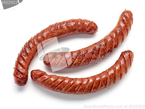 Image of grilled sausages on white background