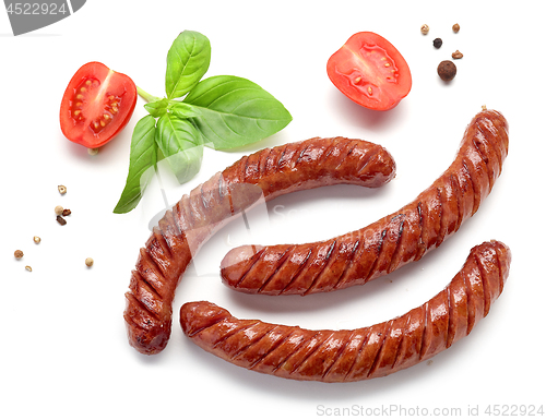 Image of grilled sausages on white background