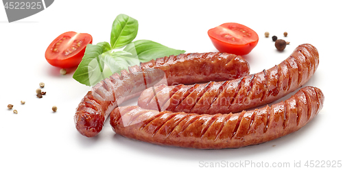 Image of grilled sausages on white background