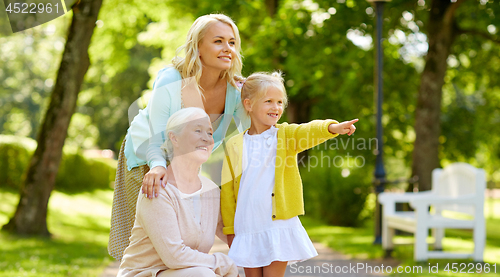 Image of happy mother, daughter and grandmother at park