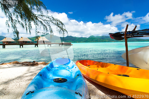 Image of kayaks moored on beach in french polynesia